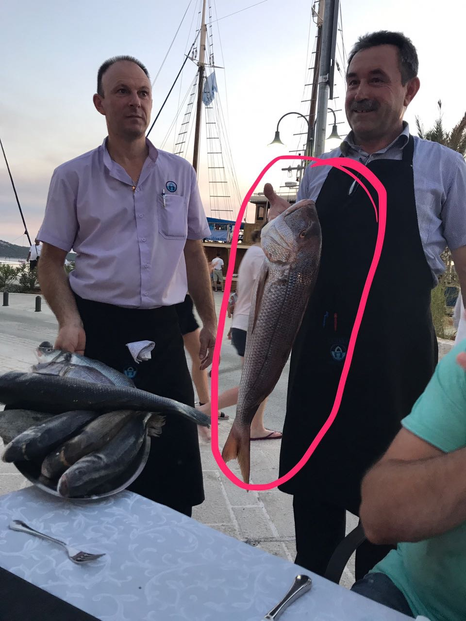 Antonijo presents the day's catch to his guests